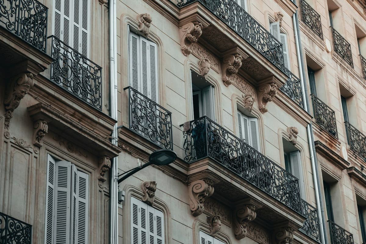 a tall building with lots of windows and balconies